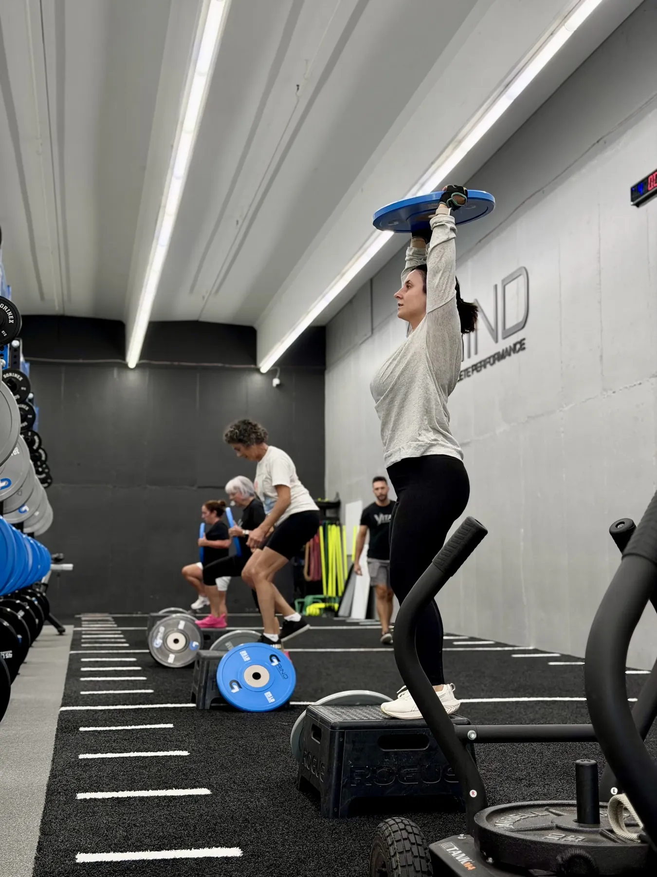 A Vital member strength training in the gym